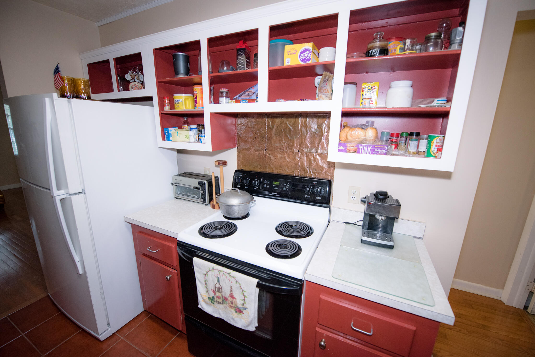 40 High Point Road, Unit F205 Tavernier, FL 33070 - Photo 9 of 14 a kitchen with a refrigerator and a stove top oven