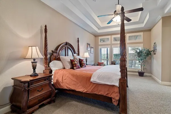 a bed room with a bed and a chandelier