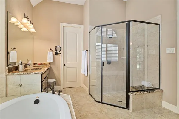 a bathroom with a tub and a sink