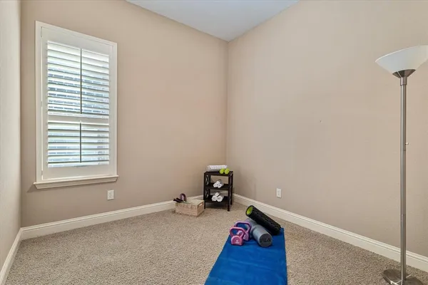 a room with a window and wooden floor