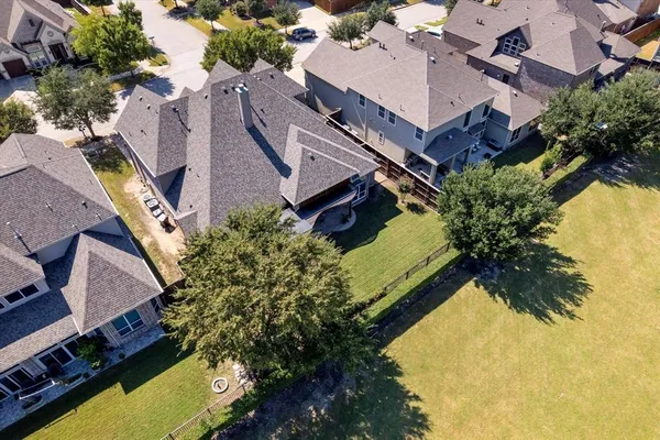 an aerial view of a house with a swimming pool