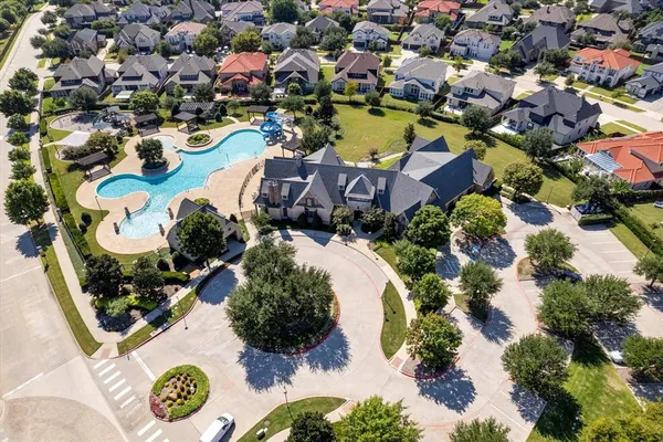 an aerial view of residential house with outdoor space and swimming pool