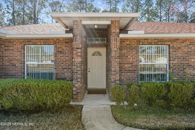 a view of a pathway along the house