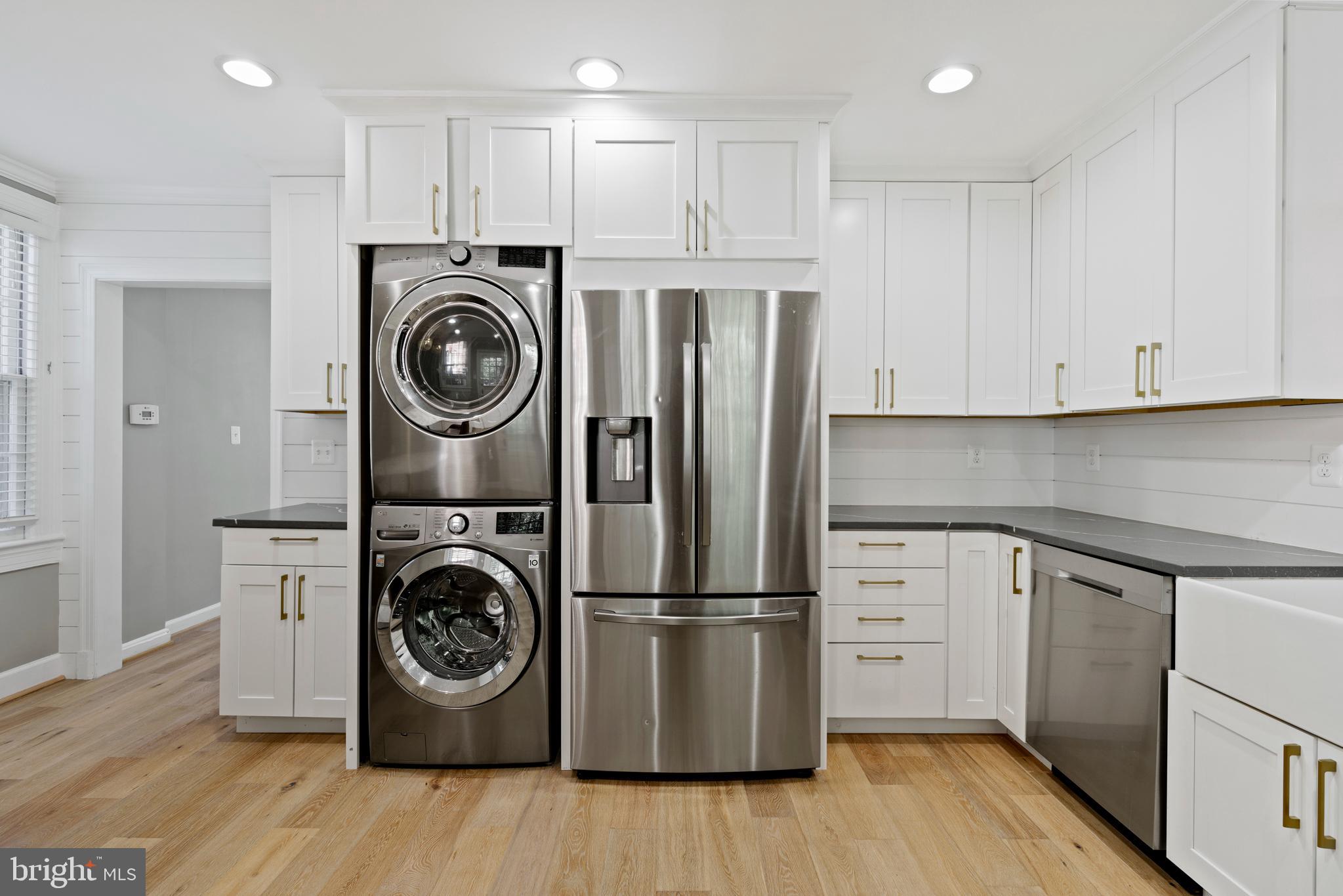 1300 South Cleveland Street, Unit 363 Arlington, VA 22204 - Photo 15 of 37 a kitchen with stainless steel appliances granite countertop a refrigerator and a stove top oven