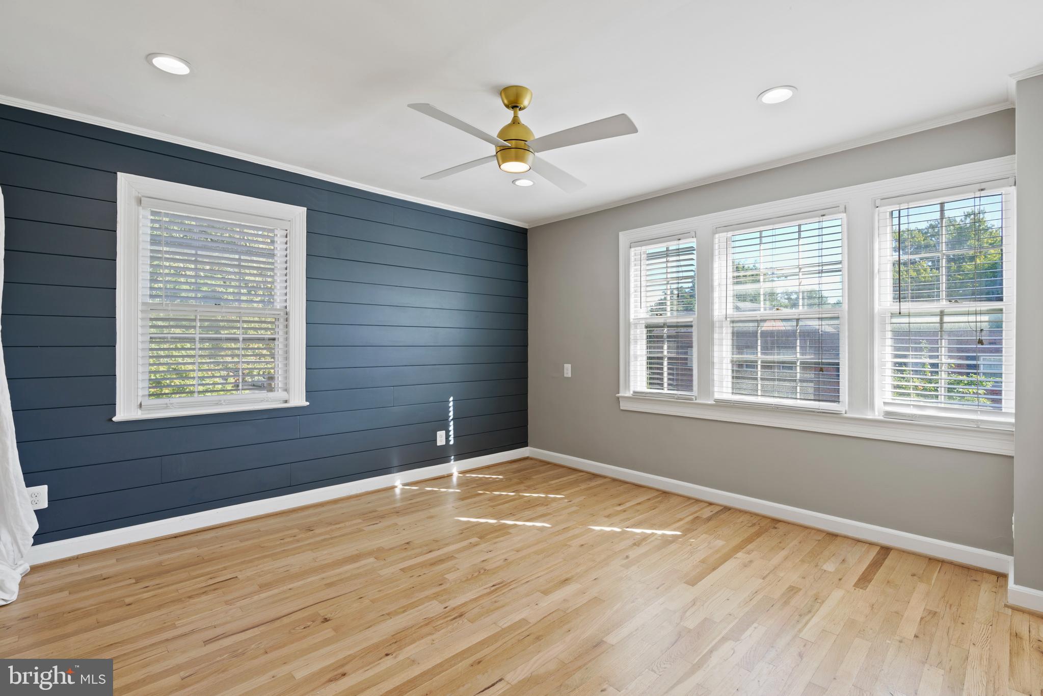 1300 South Cleveland Street, Unit 363 Arlington, VA 22204 - Photo 19 of 37 a view of an empty room with a window and wooden floor