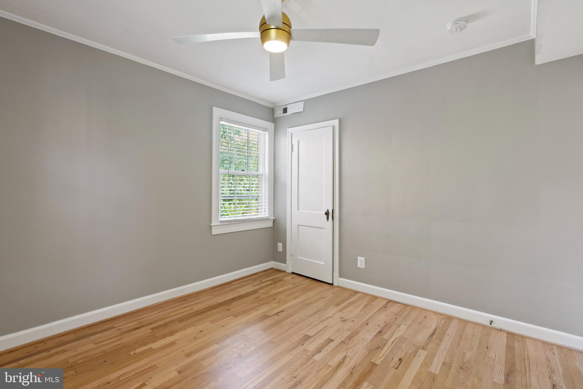 1300 South Cleveland Street, Unit 363 Arlington, VA 22204 - Photo 30 of 37 wooden floor in an empty room with a window