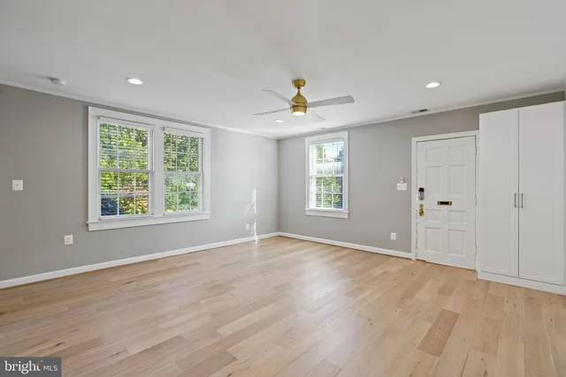 a view of an empty room with a window