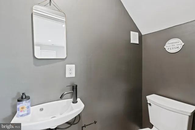 a bathroom with a toilet and a sink
