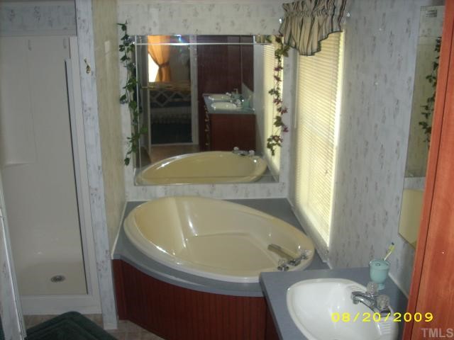 1420 Sykes Road Spring Hope, NC 27882 - Photo 8 of 11 master bath with deep soaking tub, seperate shower