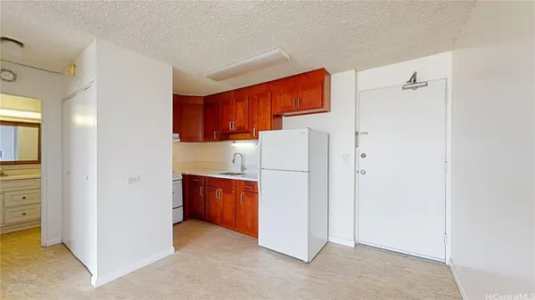 a utility room with cabinets washer and dryer