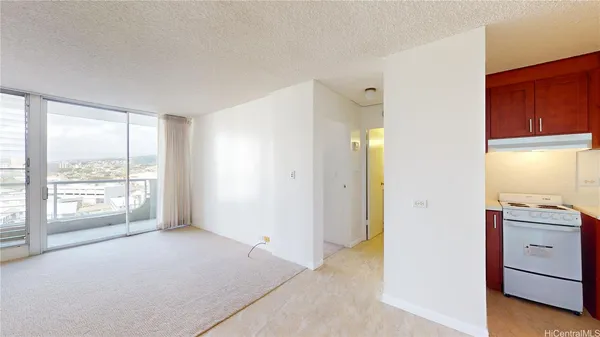 a view of an empty room with a window
