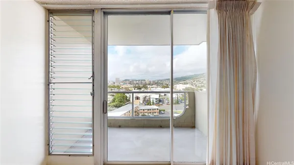 a view of a glass door with a balcony