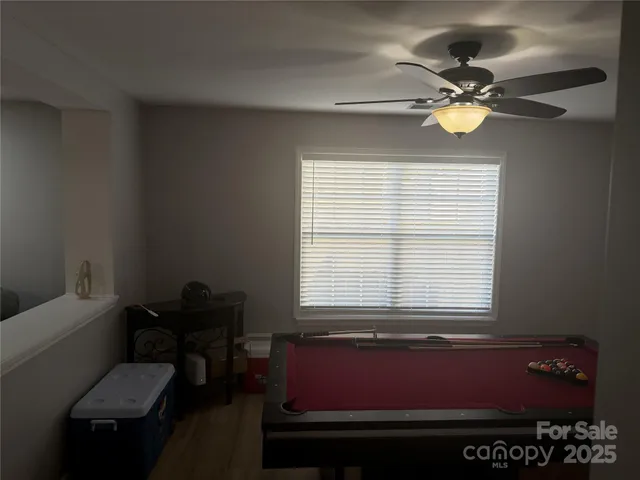 a view of a room with lounge chair and a window