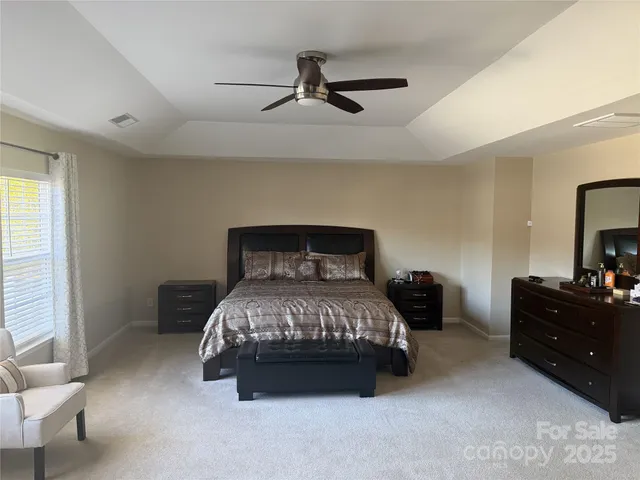 a bedroom with a bed and furniture