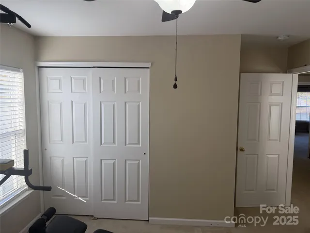 a view of a hallway with closet area