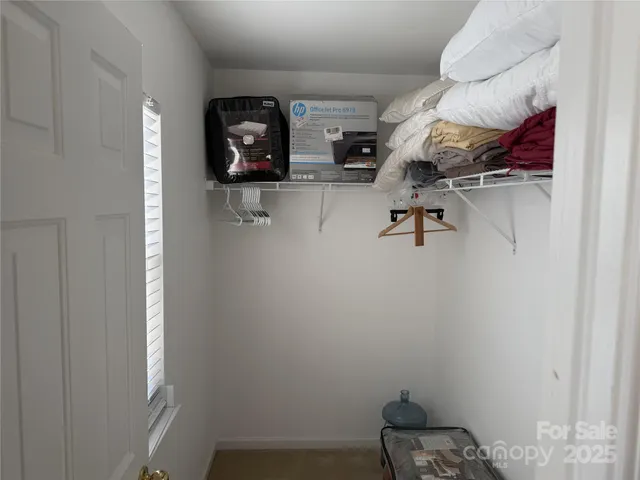 a view of storage and utility room in a laundry room