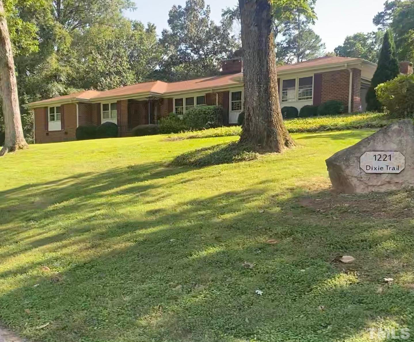 a view of house with outdoor space and swimming pool