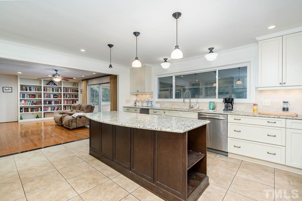 1221 Dixie Trail Raleigh, NC 27607 - Photo 11 of 26 a kitchen with a sink and cabinets