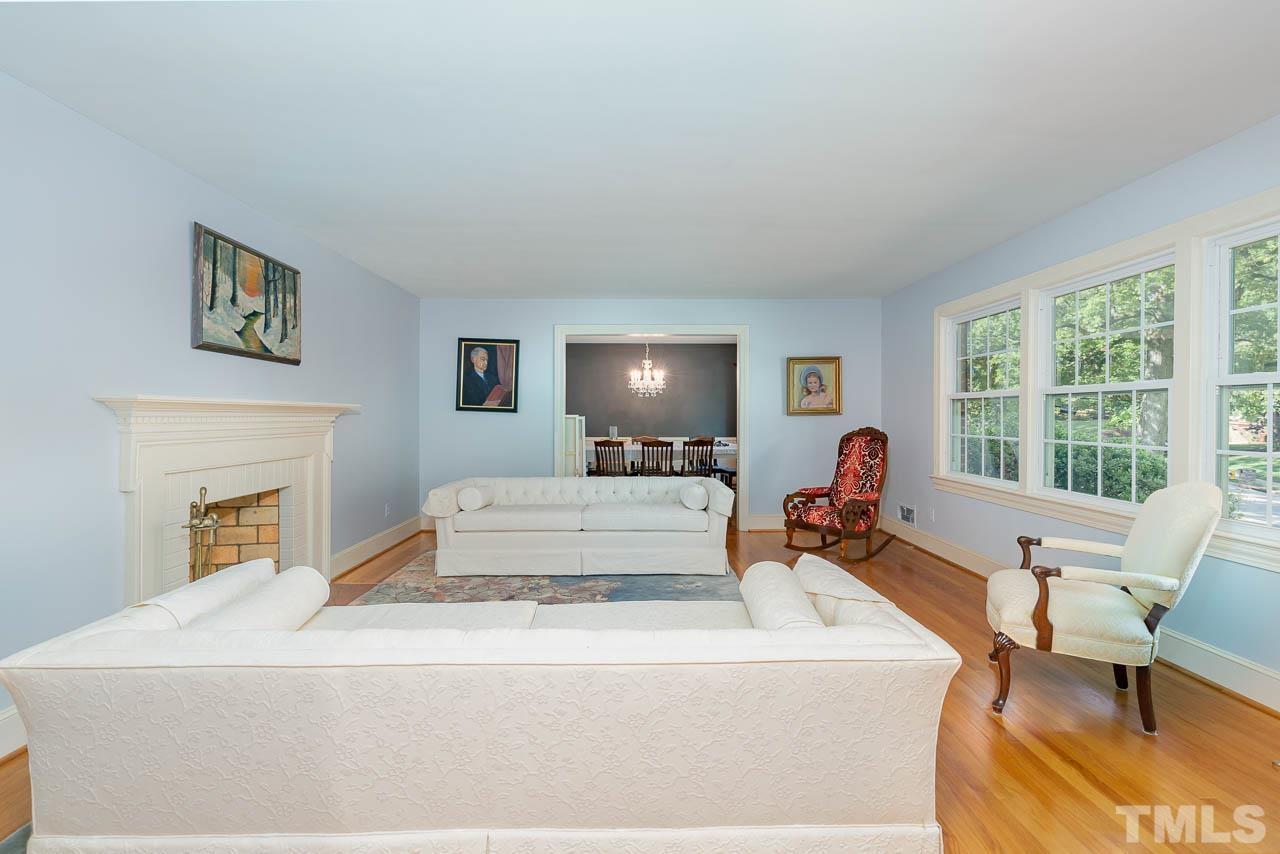 1221 Dixie Trail Raleigh, NC 27607 - Photo 5 of 26 a living room with furniture and a large window