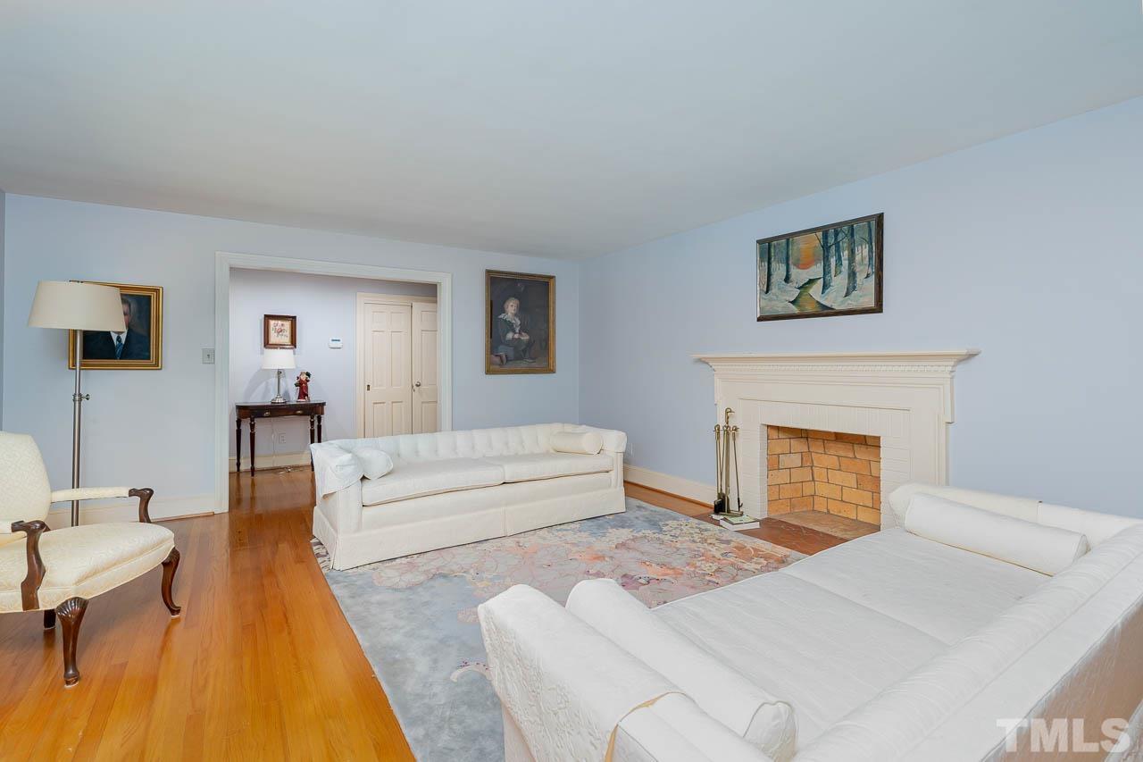 1221 Dixie Trail Raleigh, NC 27607 - Photo 6 of 26 a living room with furniture and a fireplace