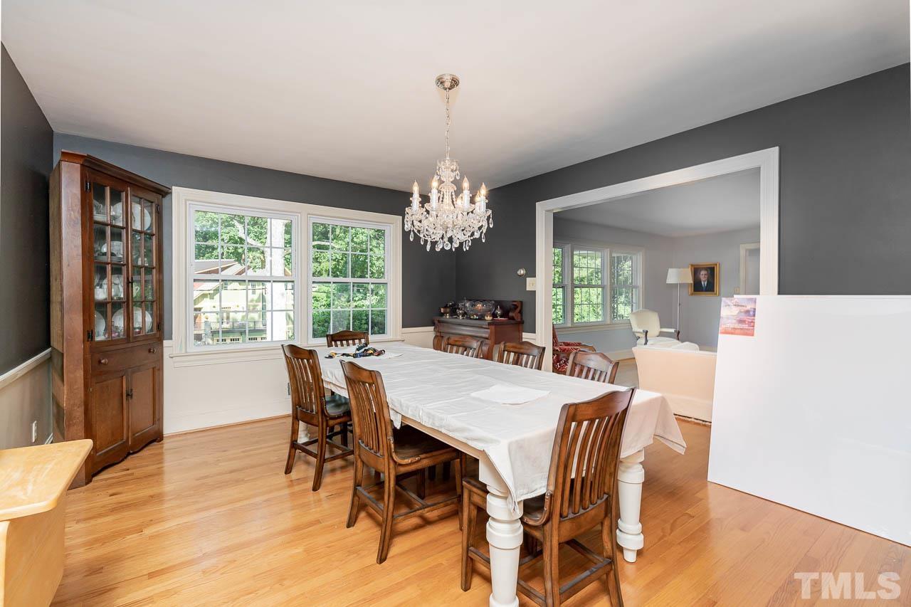 1221 Dixie Trail Raleigh, NC 27607 - Photo 8 of 26 a view of a dining room with furniture window and wooden floor