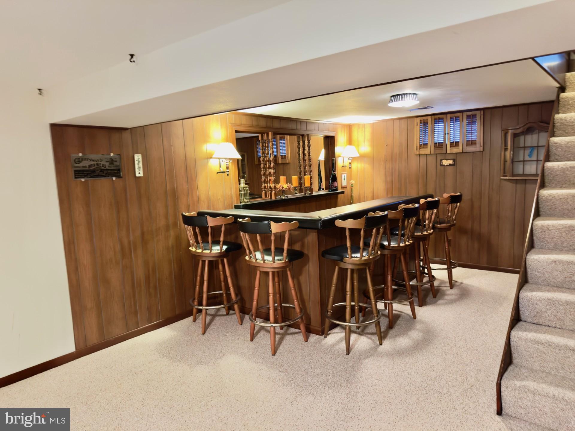 309 Cambridge Road Camden, DE 19934 - Photo 22 of 36 Bar with bar chairs to entertain company