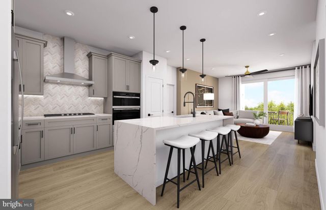 a kitchen with stainless steel appliances kitchen island a large island in the center