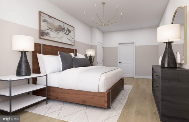 a bed room with a bed and a lamp