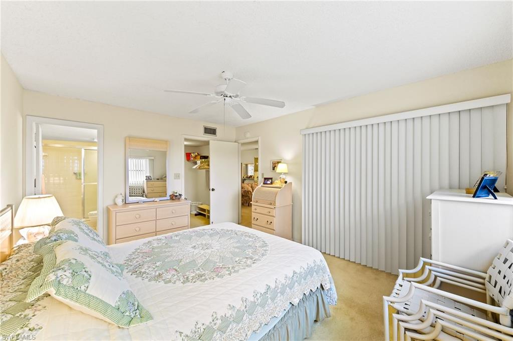 5467 Rattlesnake Hammock Road, Unit 302C Naples, FL 34113 - Photo 20 of 29 Bedroom with sliders to lanai