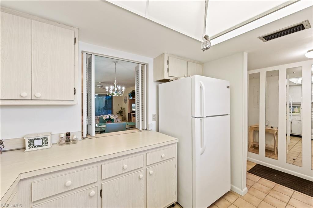 5467 Rattlesnake Hammock Road, Unit 302C Naples, FL 34113 - Photo 9 of 29 pass through to dining area