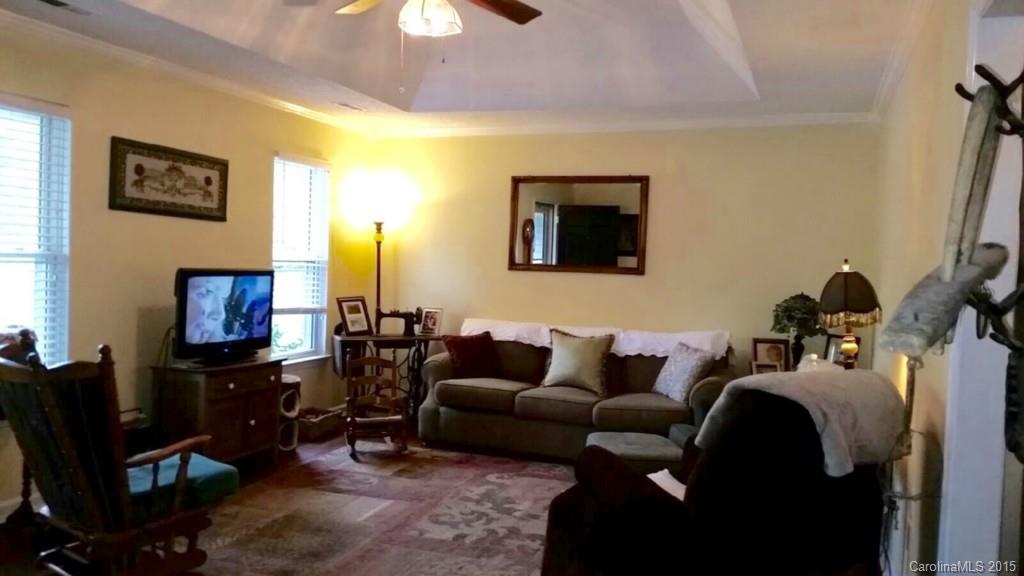 203 Williams Road Wingate, NC 28174 - Photo 2 of 5 a living room with furniture and a flat screen tv