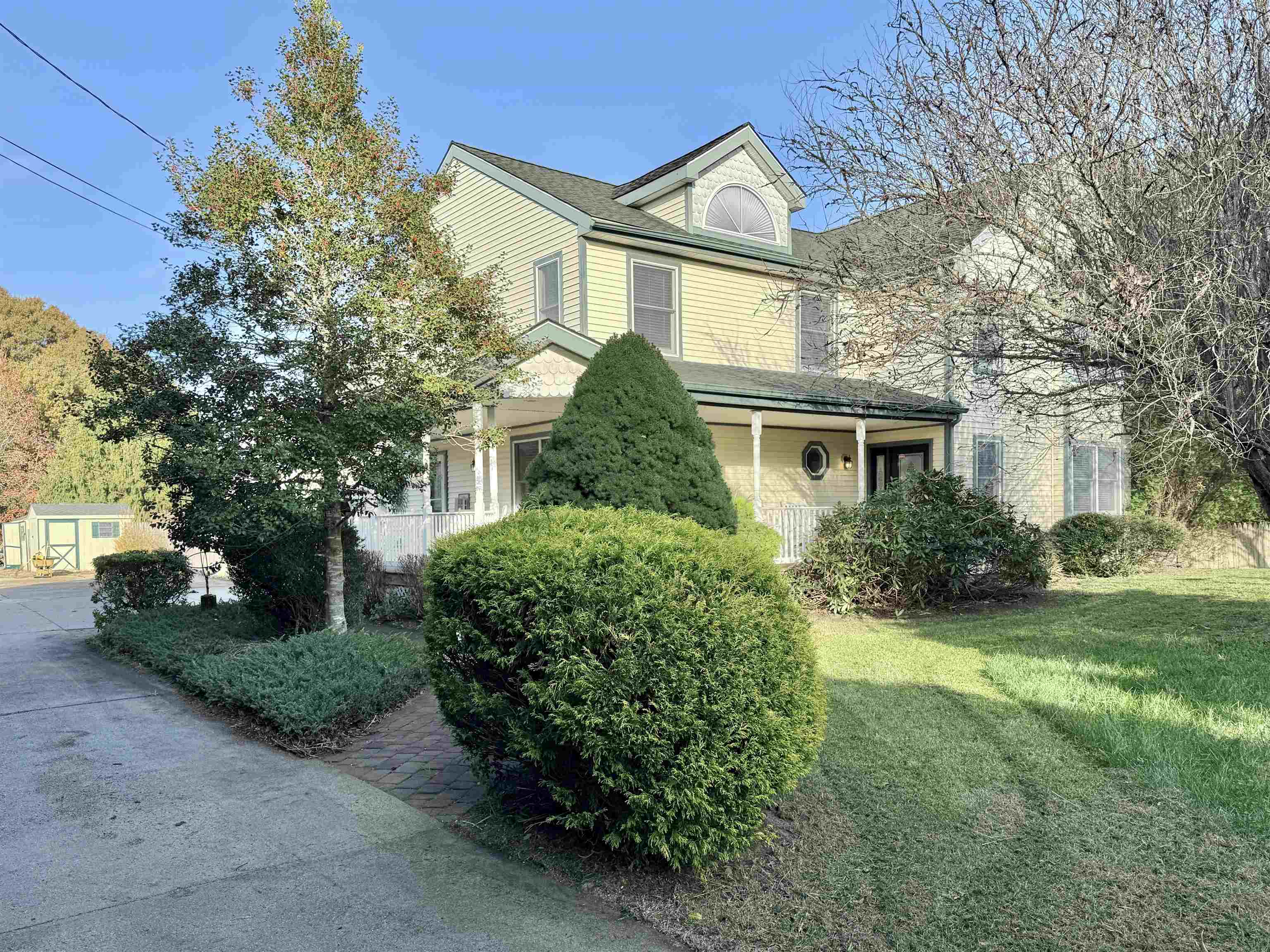 front view of a house with a yard