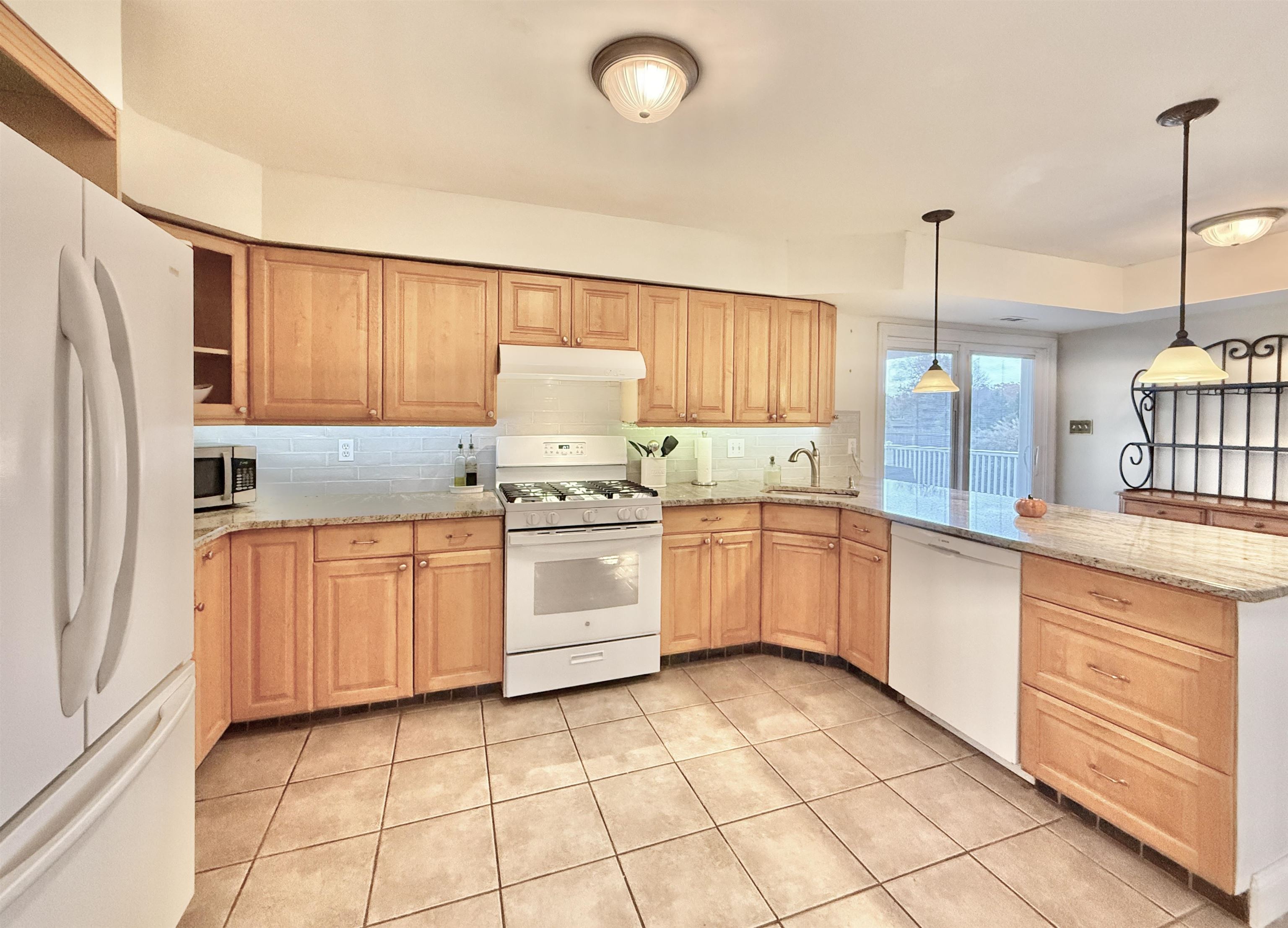 1981 Tuckahoe Road Woodbine, NJ 08270 - Photo 21 of 37 a kitchen with granite countertop cabinets and appliances