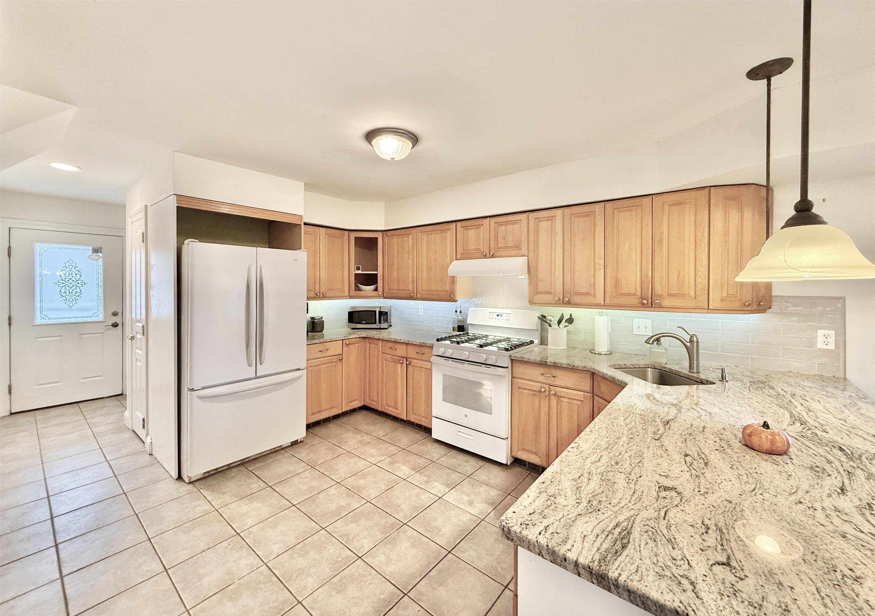 1981 Tuckahoe Road Woodbine, NJ 08270 - Photo 22 of 37 a kitchen with stainless steel appliances granite countertop a refrigerator sink and cabinets