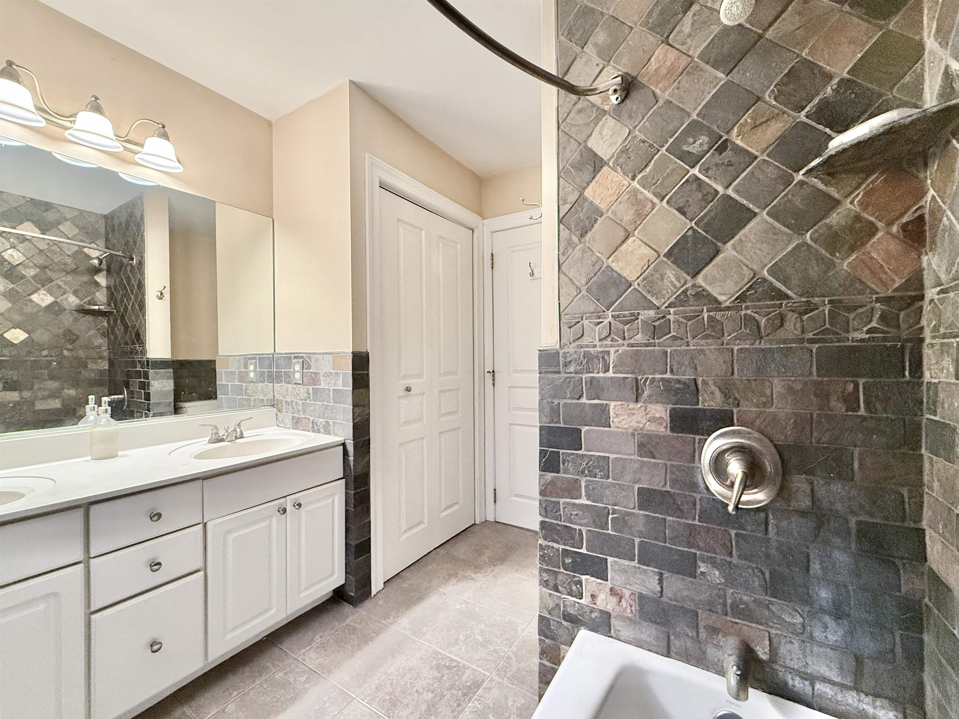 1981 Tuckahoe Road Woodbine, NJ 08270 - Photo 30 of 37 a bathroom with a double vanity sink mirror and shower