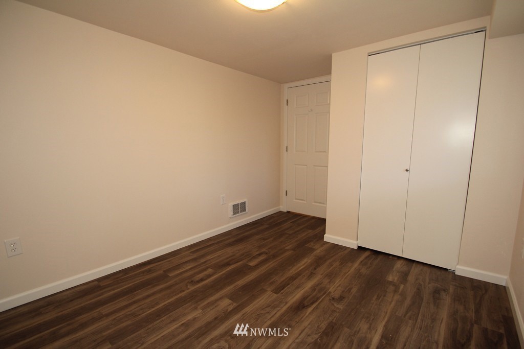 81 Southwest 2nd Street Renton, WA 98057 - Photo 14 of 22 a view of an empty room with wooden floor