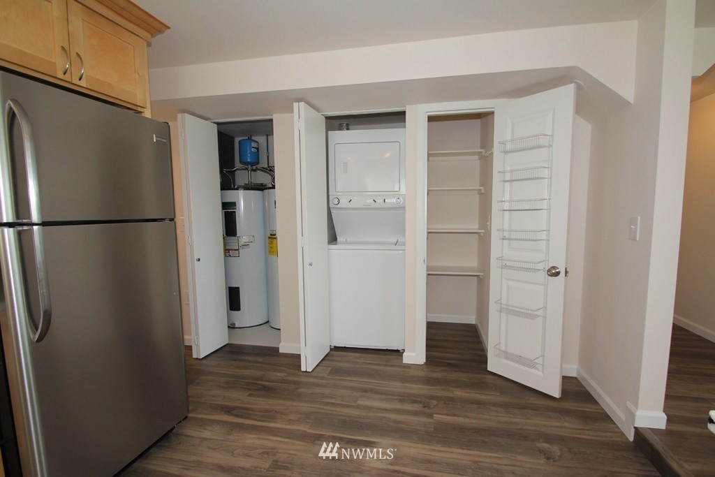 81 Southwest 2nd Street Renton, WA 98057 - Photo 20 of 22 a view of a refrigerator in kitchen and wooden floor