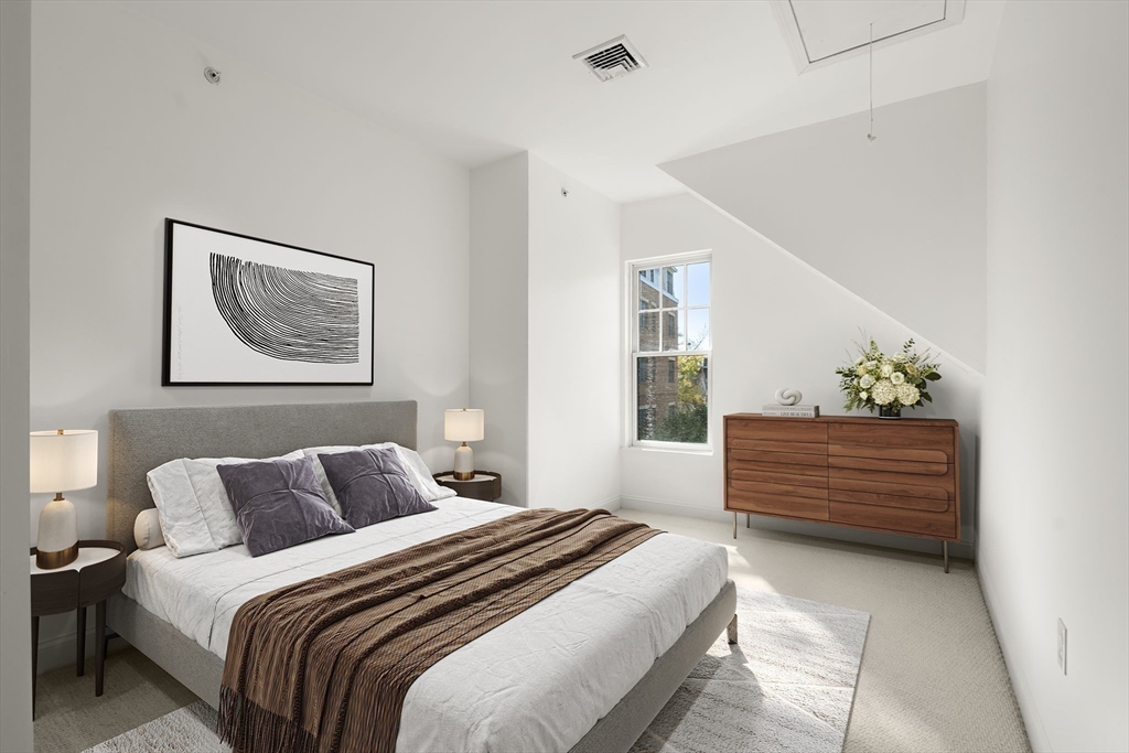 125 Crowninshield Road, Unit 125 Brookline, MA 02446 - Photo 19 of 22 a bedroom with bed and window