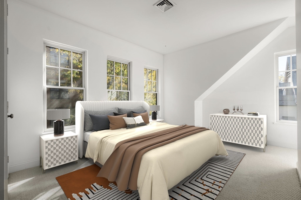 125 Crowninshield Road, Unit 125 Brookline, MA 02446 - Photo 20 of 22 a bedroom with bed and a window