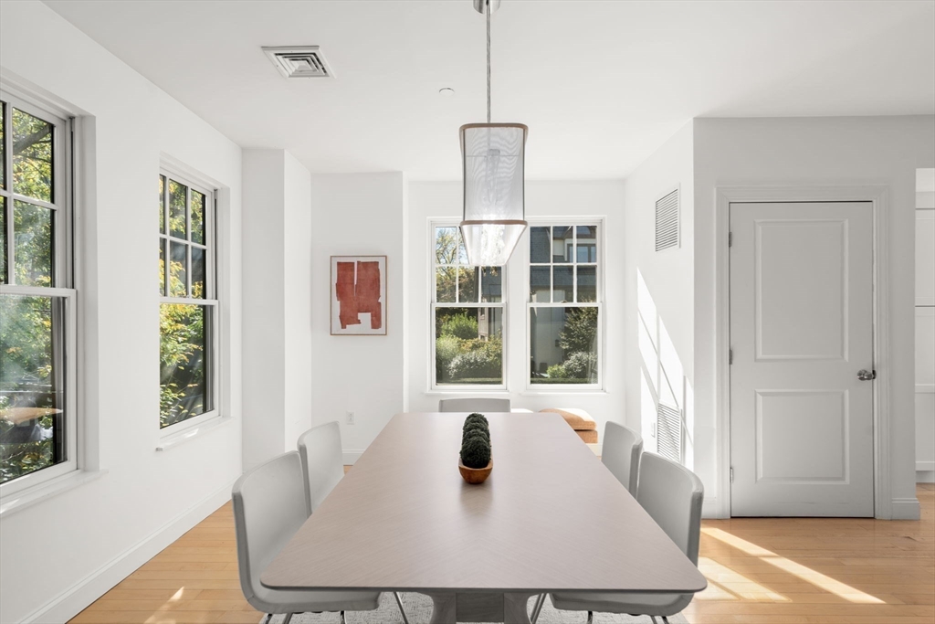 125 Crowninshield Road, Unit 125 Brookline, MA 02446 - Photo 9 of 22 a view of a dining room with furniture and window