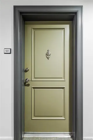 a view of a room with a flat screen tv