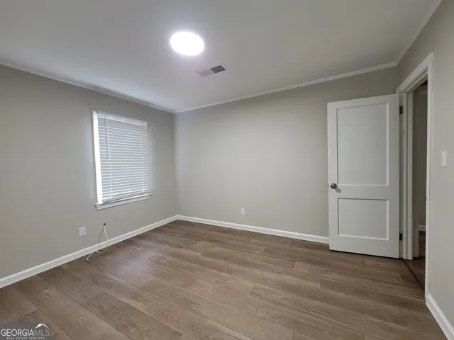 a view of a wooden deck with a bench