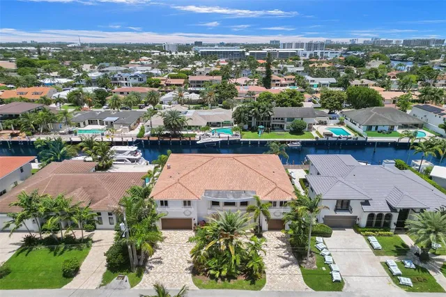 an aerial view of a house with a lake view