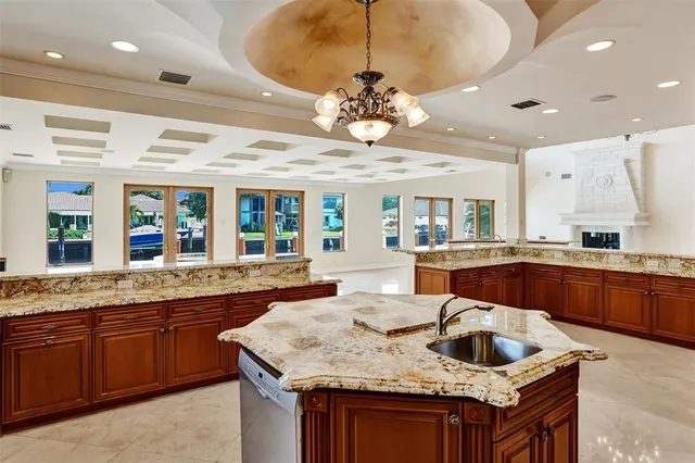 a bathroom with a granite countertop toilet a sink and a bathtub