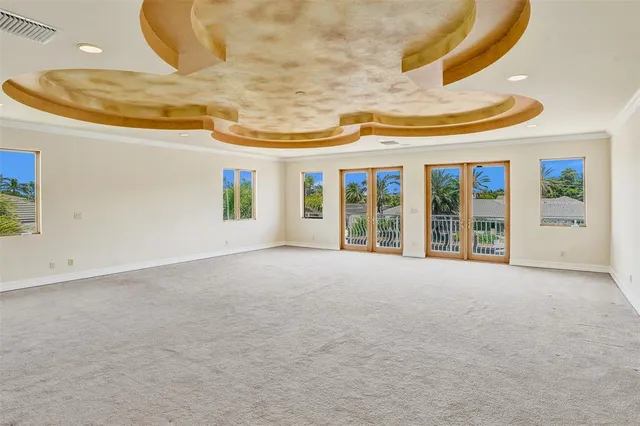 an aerial view of a house with a ocean view