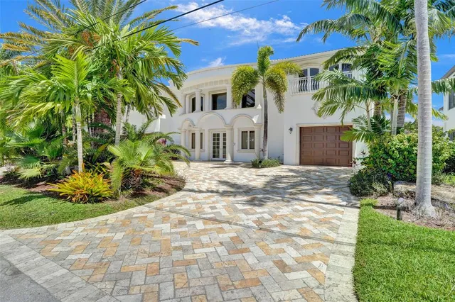 a large kitchen with stainless steel appliances granite countertop a large stove a sink dishwasher and a refrigerator with wooden floor