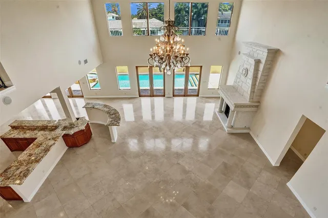 a kitchen with stainless steel appliances granite countertop a sink refrigerator and cabinets