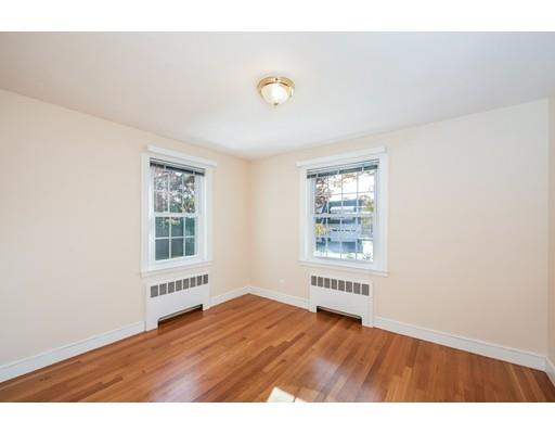 13 Churchill Road Marblehead, MA 01945 - Photo 13 of 26 a view of an empty room with a window and wooden floor