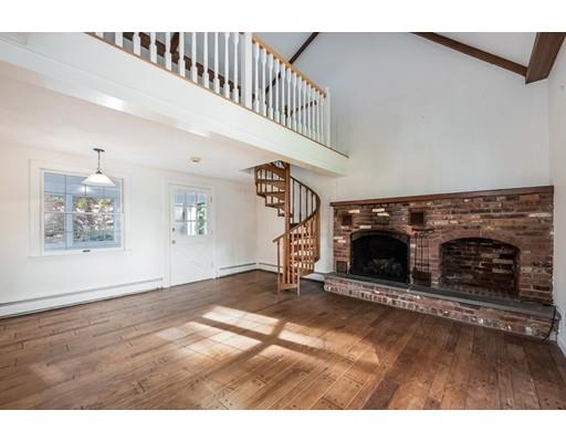 13 Churchill Road Marblehead, MA 01945 - Photo 9 of 26 a view of an empty room with wooden floor fireplace and a window