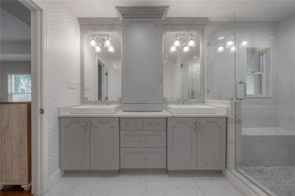 3108 West Villa Rosa Street Tampa, FL 33611 - Photo 26 of 58 a bathroom with a double vanity sink and a mirror